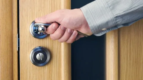 Man open and close a door Stock Footage 60704930