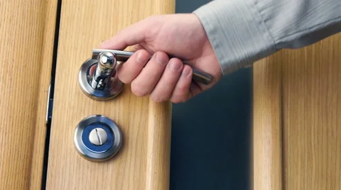 Man open and close a door Stock Footage 60704942