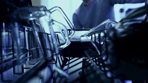 Man open the dishwasher Stock Footage 84856563