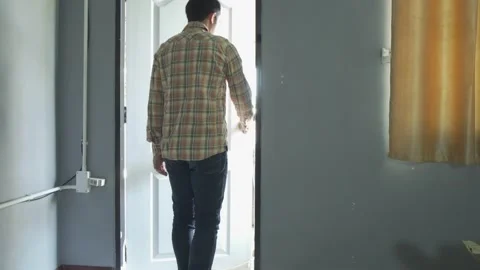 Man open the door outside the room Stock Footage 146304497