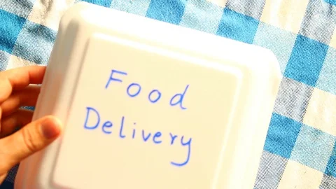 Man open empty food box , in  door  Chiangmai Thailand 库存影片 130048295