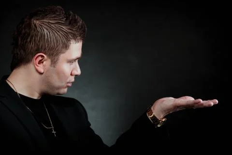 Man with open empty hand copyspace for product Stock Photos