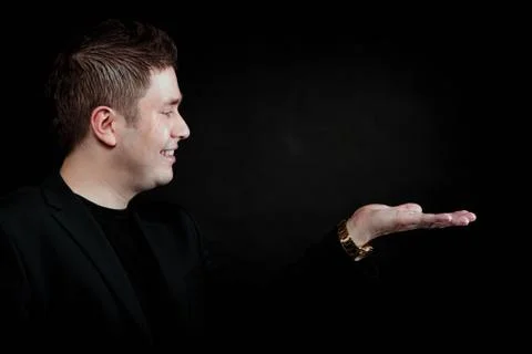 Man with open empty hand copyspace for product Stock Photos