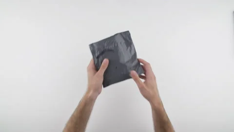 Man open post package with his hand, smartphone protective case inside. Stock Footage 138052228