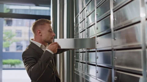 Man open private mailbox checking correspondence closeup. Upset guy look letter Stock Footage 262468301