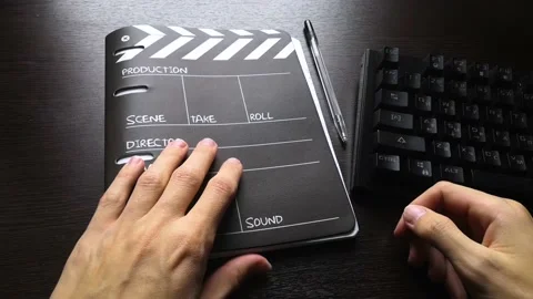 The man opened the notebook and after he closes it Stock Footage 160555794