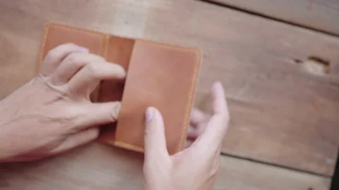 The man opened the wallet and had no money. Stock-Footage 148101933