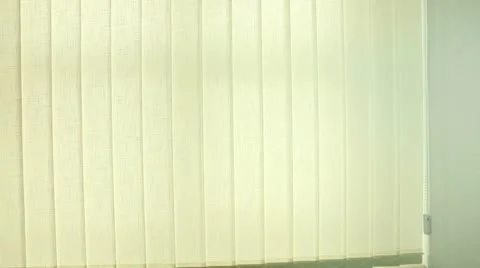 Man opening and turning vertical blinds on the office window Stock Footage 22283388