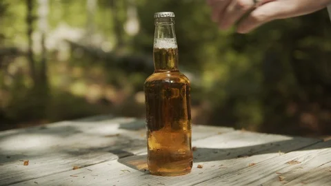 Man Opening Beer Bottle With Lighter Slow motion, 4k Stock Footage 111930257