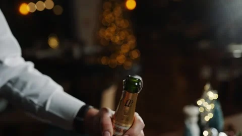 A man is opening a bottle of champagne Video stock 295996397