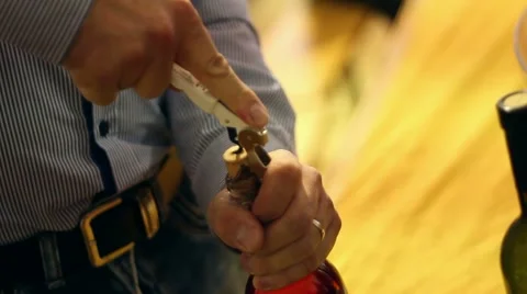 Man opening a bottle of wine Stock Footage 47211684
