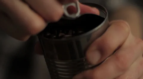 Man opening can of coffee beans Slow Motion Stock Footage 30460949