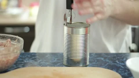 Man opening can in the kitchen Stock Footage 22027678
