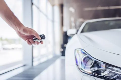 Man opening car with keys Stock Photos