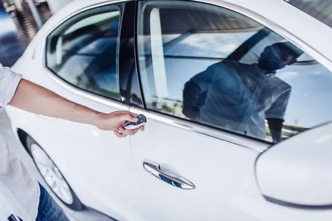 Man opening car with keys Stock Photos