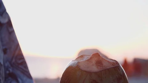 Man opening coconut in slow motion Stock Footage 128013446