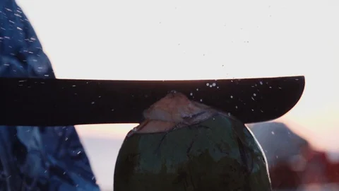 Man opening coconut in slow motion 2 動画素材 128013532
