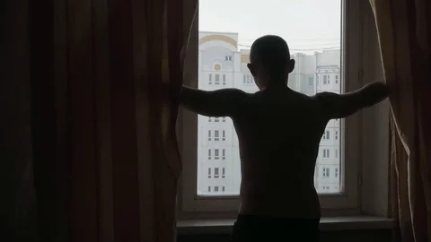 Man Opening Curtains. View on the Panel Building. 스톡 동영상 85123606