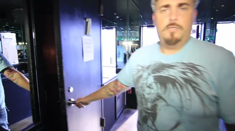 Man opening door and walking into recording studio As 02 Stockbeeldmateriaal 35340161