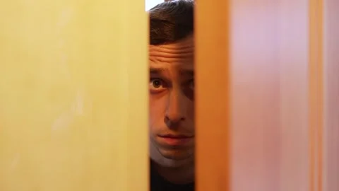 Man opening the door with a hostile expression. Stock Footage 312473486