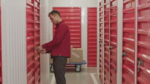 Man Opening Door of Storage Unit and Walking Inside Stock Footage 259826258