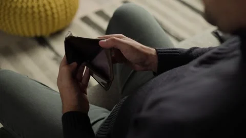 Man Opening Empty Leather Wallet Indoor Video stock 346810358