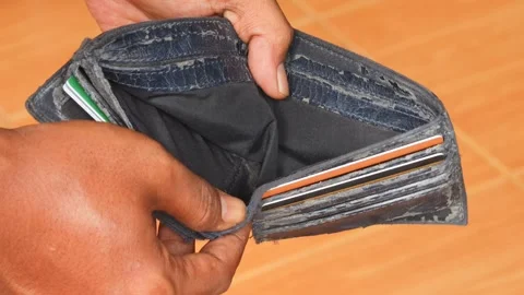 Man opening an empty wallet with no money inside Stock Footage 336298750