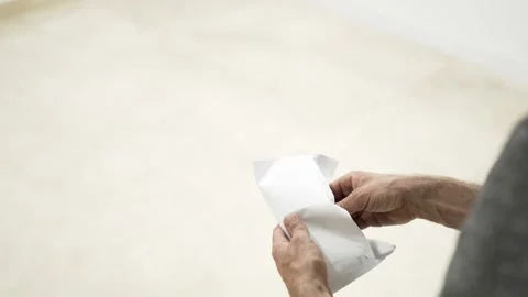 Man opening envelope and taking out cash money Stock Footage 309772913