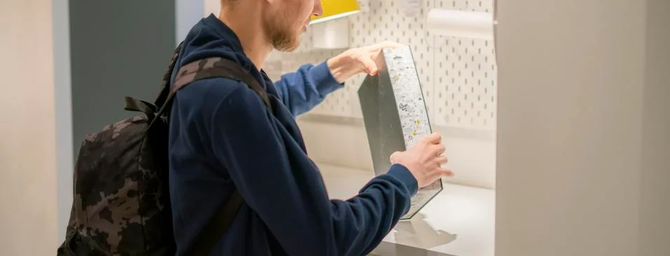 Man opening folder with papers sitting at the table Stock Photos
