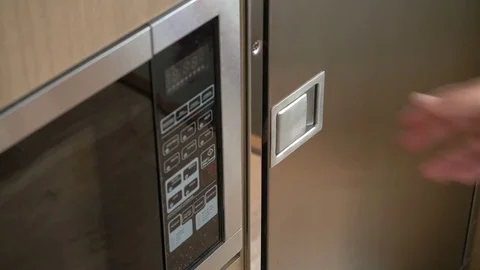 Man opening fridge on a boat Stock Footage 72525104