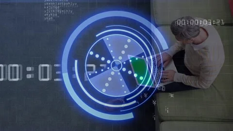 Man opening laptop and typing on couch, HUD rotating with timer advancing while Stock Footage 332613685