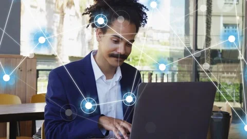 Man opening laptop and typing in cafe, activating node overlay growing across Video stock 333774512