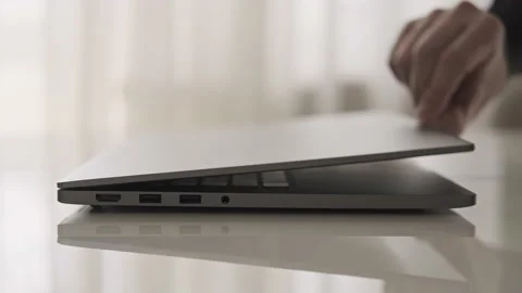 Man opening laptop. Technology concept with copy space. Close-up in 4K, UHD Video stock 133780886