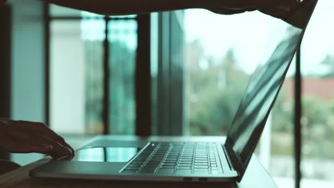 Man opening laptop for working. Technology concept. Close-up in 4K Stockbeeldmateriaal 157775745