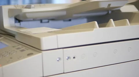 Man opening the lid of an office copier and putting a document for making a copy Stock Footage 67207158