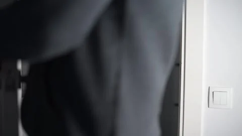 Man opening modern white door with metallic handle Stock Footage 293670967