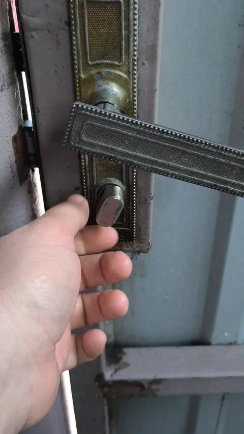 Man opening old lock. hand turning key to open old weathered wooden door wi.. Stock Footage 314830190
