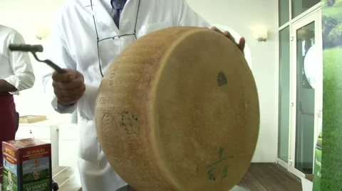 Man opening Parmesan cheese wheel  Stock Footage 41687485