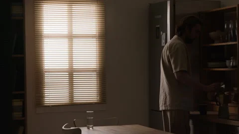 Man Opening Refrigerator during Morning Routine in Kitchen Stock Footage 345516361
