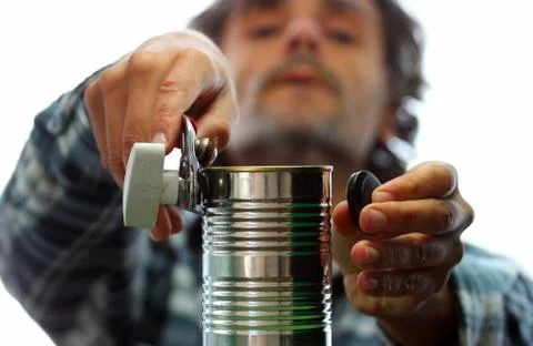 Man opening tin can Stock Photos