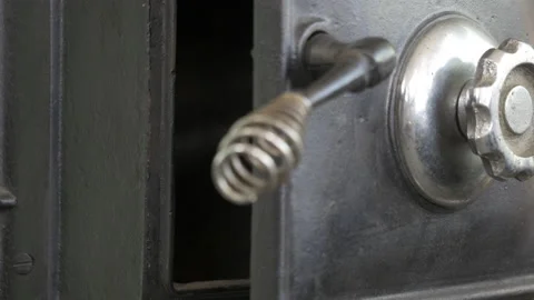 Man opening a vintage safe Stock Footage 146009683