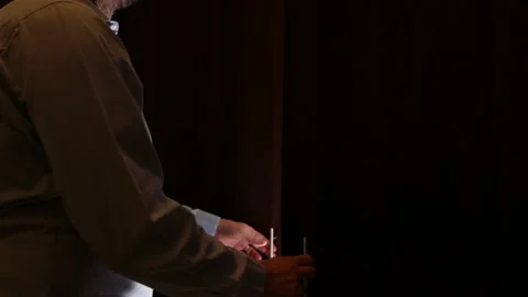 Man opening a wardrobe closet full of disposable masks hanging instead of clo Stock Footage 134132773