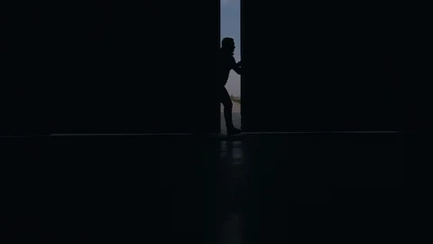 A man opens an aircraft hangar Stock Footage 128523834