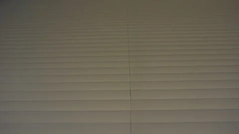 	Man opens and closes the curtains on the window. Stock Footage 94489469