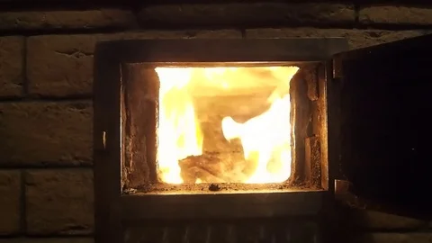 Man opens and closes door in wood fired oven with flame Stock Footage 75163545