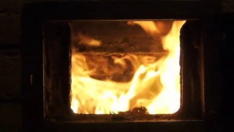 Man opens and closes door in wood fired oven with flame Stock Footage 75163968