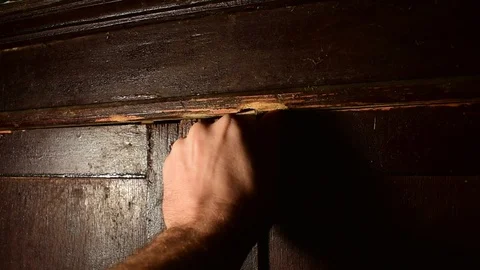Man opens and closes the door of the old  cupboard Stock Footage 120602317