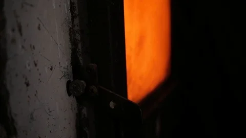 A man opens and closes the oven door Stock Footage 99577049