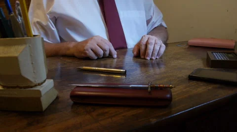 Man opens and reads Bible in his office desk Stock Footage 56719720