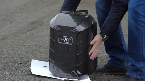 Man opens backpack with with the drone. Stock Footage 69959595